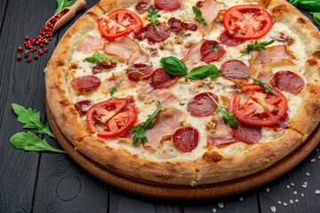 Pizza with mozzarella cheese, salami and chicken meat