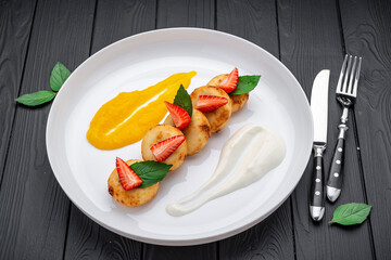 Creative baby breakfast cheesecakes with strawberry.