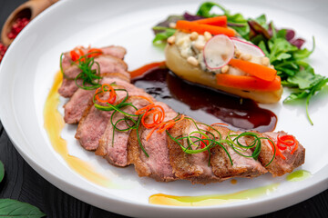 Plate with duck breast and pear, duck L'Orange