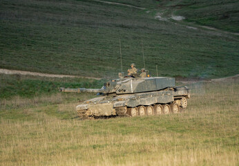 commander and gunner directing action in a British army FV4034 Challenger 2 ii main battle tank on...