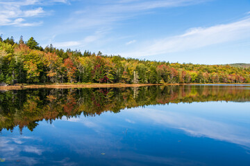 Chasing Fall foliage and reflections along the "Little" Long Pond loop trail near Seal Harbor, Maine.