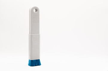 close-up of a plastic extending PC and IT dush brush with blue nylon bristles