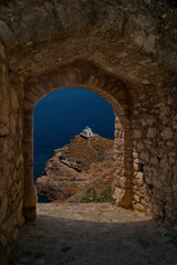 Small church through old castle on Sifnosi island, Greece - 561508050