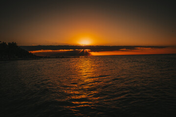 Magical view to ocean with and orange sunset colours in Holbox, Mexico