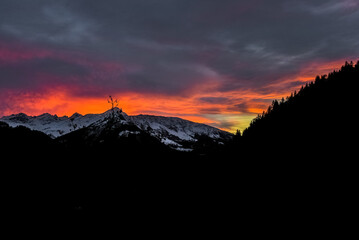 beautiful last rays sunset over the mountains in Graubunden, Switzerland