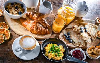 Breakfast served with coffee, eggs, cereals nd croissants
