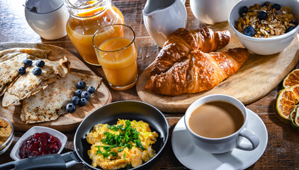 Breakfast served with coffee, eggs, cereals nd croissants