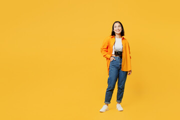 Fototapeta na wymiar Young happy fun woman wear summer casual clothes look aside on area mock up isolated on plain yellow background. Tourist travel abroad in free spare time rest getaway. Air flight trip journey concept.
