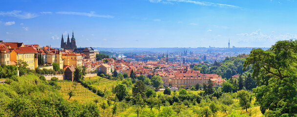 Fototapeta Summer cityscape, panorama, banner - view of the Hradcany historical district of Prague and castle complex Prague Castle, Czech Republic obraz