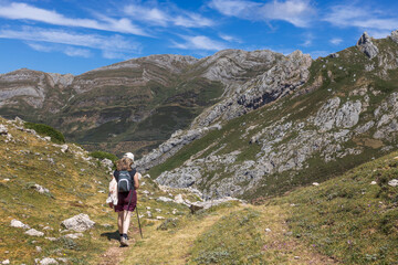 Fototapeta premium Woman Hiking at Somiedo Natural Park, Asturias, Spain