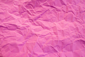 Obraz premium Crumpled pink paper texture background