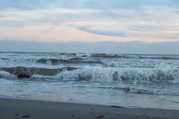 Black sea with seagulls and stones