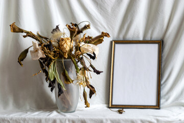 Photo frame mockup with dried dry flowers in a vase, still life