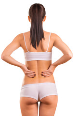 A slender brunette woman in white sports underwear  isolated on white background. Back view