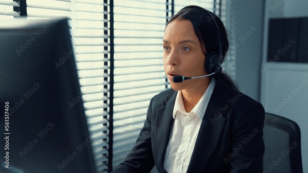 Poster competent female operator working on computer and talking with clients. concept relevant to both cal