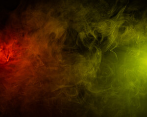 Red yellow green smoke on a black background.