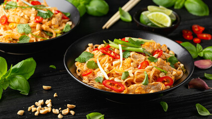 Chicken Pad Thai with eggs, bean sprouts, peanuts and spring onion