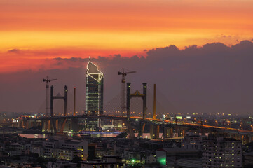 Twilight brings to life the metropolis of Bangkok's new bridge building..