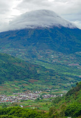 Beautiful natural view. Mountain Sindoro with clouds of Dieng. 