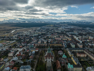 Aerial view of the city of Nowy Targ in Poland - obrazy, fototapety, plakaty