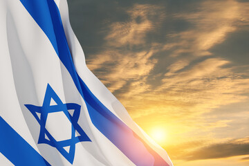 Israel flag with a star of David over cloudy sky background on sunset. Patriotic concept about...