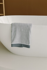 Gray towel in bathroom. Fresh towel. Natural
