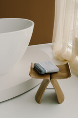 Gray towel in bathroom. Fresh towel. Natural. Vertical