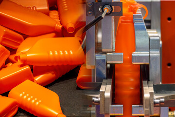 Abstract scene the oil lubricant  container manufacturing process by blow mold machine.