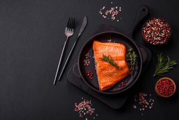 Delicious baked salmon red fish steak with spices and herbs