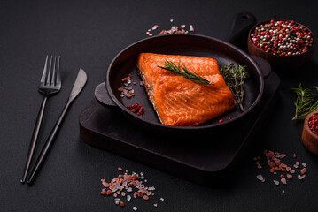 Delicious baked salmon red fish steak with spices and herbs