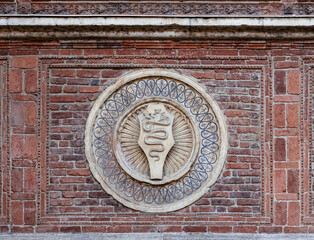Medieval symbol of the city on the wall of the ancient basilica Santa Maria delle...