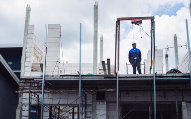 Lanscape of house, building, condominium construction structure wih worker or civil engineer standing in outdoor site. Real Estate Investment, Architecture Concept.