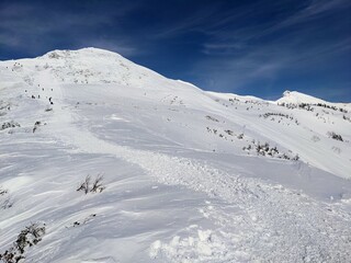 The white mountain trail to Mt. Hotaka under the blue sky in February. Minakami Town, Gunma Prefecture, Japan