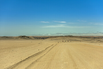 Fototapeta na wymiar sand road through the moon landscape landscape near Swakopmund, Namibia