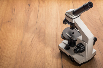 general view of a microscope on a wooden table