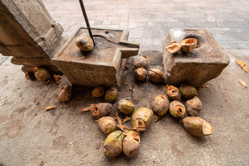 An ancient stone altar to break coconuts for rituals and sacrifice at a Hindu temple in Tiruchirappalli.