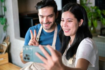 love and romantic couple boyfriend and girlfriend selfie photo with mobile phone together during dinner cook for valentine celebration in kitchen