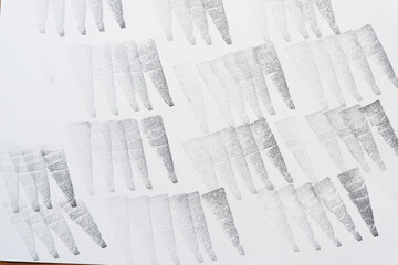 background with ink-stamp pattern (triangle or wedge pointing downwards)