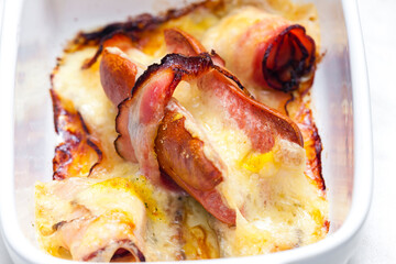 wurst in bacon baked with chedar cheese