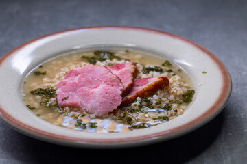 broth with smoked meat and groats