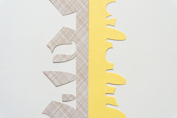 two former stencils with cutout shapes on blank paper
