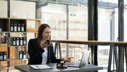 Woman lawyer working on a laptop. Legal law, advice and justice concept.