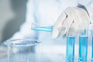 Scientist experimental in laboratory with test tube and beaker for medical research