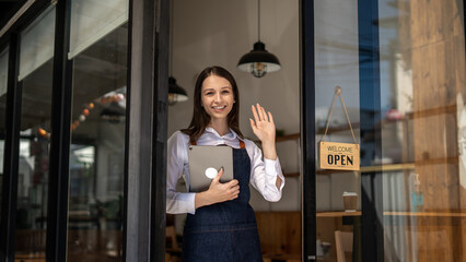 Opening a small business, Happy woman in an apron standing near a bar counter coffee shop, Small business owner, restaurant, barista, cafe, Online, SME, entrepreneur, and seller concept.