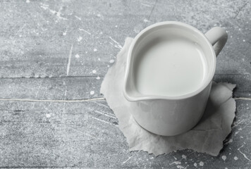 Milk in a cup on paper.