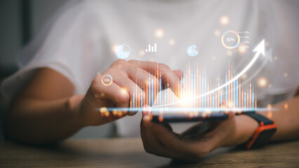 Business graph showing up on a virtual screen.New startup ideas and business growth concepts.