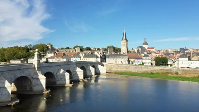 The medieval bridge of Charite sur Loire in Europe, France, Burgundy, Nievre, in summer, on a sunny day.