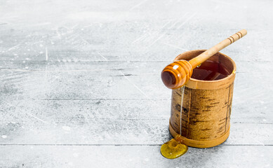 Natural honey with a spoon.