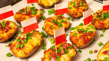 Twice-baked potatoes stuffed with mashed potato filling and topped with mozzarella cheese,  fried crispy bacon, and chopped chives. Jacket potatoes