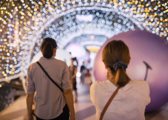 Blur image of traveller people visit city light up at Siam Paragon